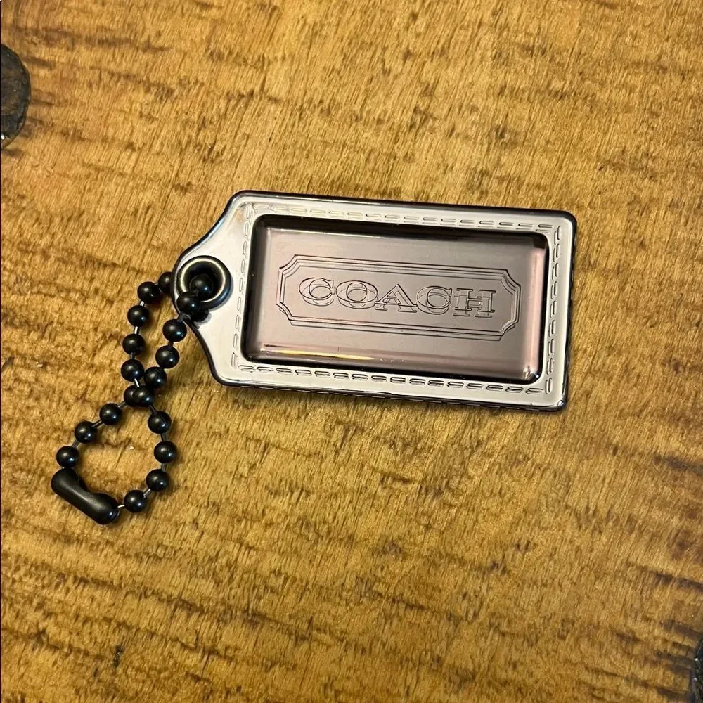 Coach Poppy plastic hangtag smoky gray with chunky ballchain